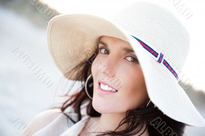 Summer portrait of beautiful woman wearing hat. Vacation at warm