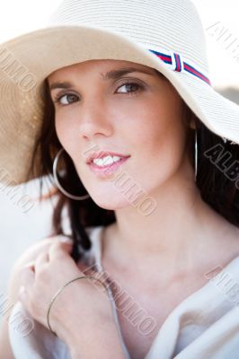 Summer portrait of beautiful woman wearing hat. Vacation at warm
