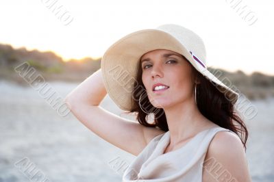 Summer portrait of beautiful woman wearing hat. Vacation at warm
