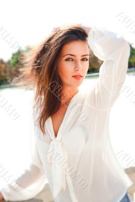 Portrait of beautiful hispanic woman posing and dancing outdoors