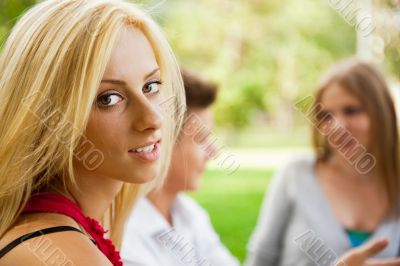 Portrait of three young teenagers laughing and having fun togeth