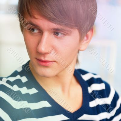 Portrait of young man inside shopping mall sitting relaxed on co Portrait of young man inside shopping mall sitting relaxed on co