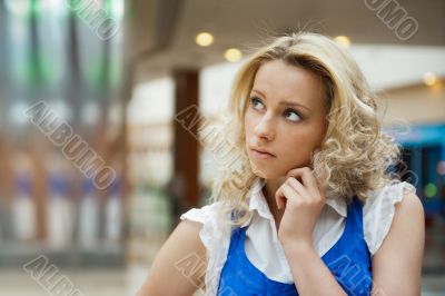 Portrait of a beautiful thoughtful woman smiling intdoors