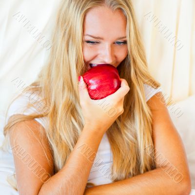 Closeup portrait of young pretty woman lying in her bed at morni