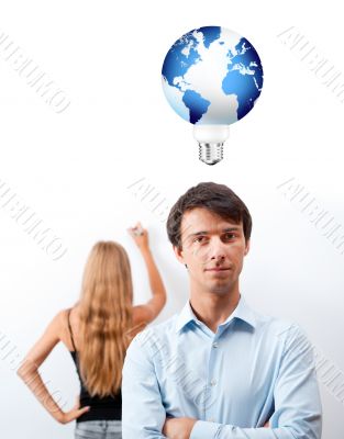 Closeup of adult teacher with student presenting her work on whi