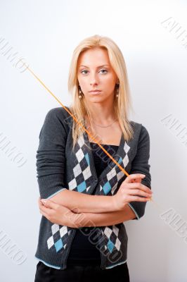 Portrait of young teacher pointing on white marker board in mode