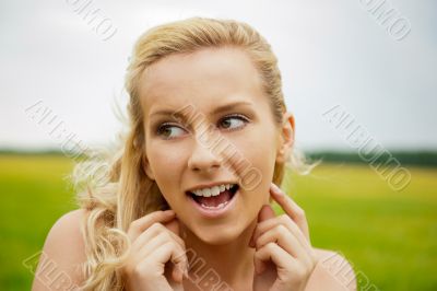 A portrait of a beautiful young Caucasian woman outdoor