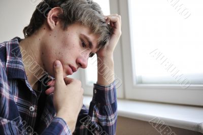 Happy young handsome man at home