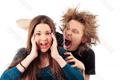 Mad man with funny hairdo tempting young girl for something