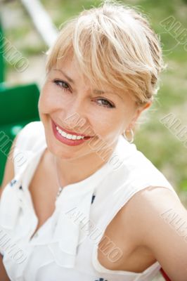 Portrait of a female smiling in a park