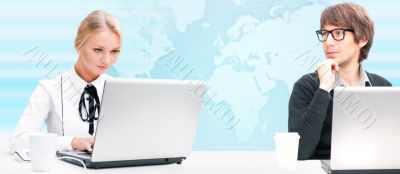 Portrait of a team of business people confidently sitting togeth