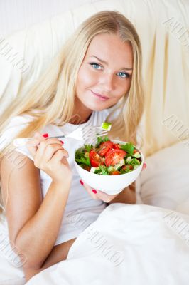 Closeup portrait of pretty caucasian woman having a healthy diet