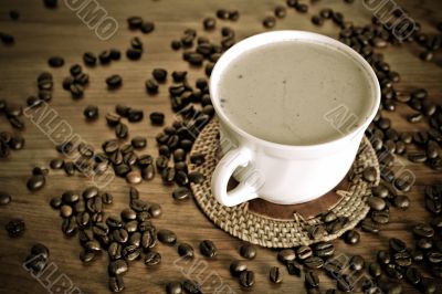 warm cup of coffee on brown background