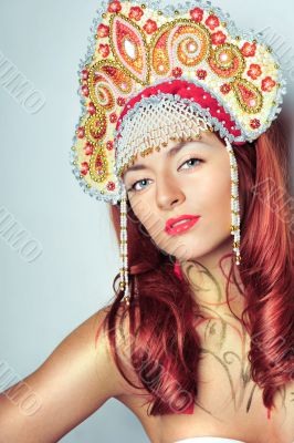 Closeup portrait of pretty young woman with red hairs