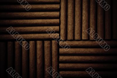 Vintage background with cigarettes on brown wooden background