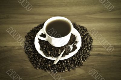 warm cup of coffee on brown background