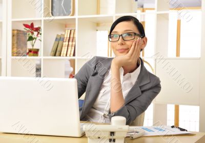 Portrait of a beautiful young businesswoman thinking.