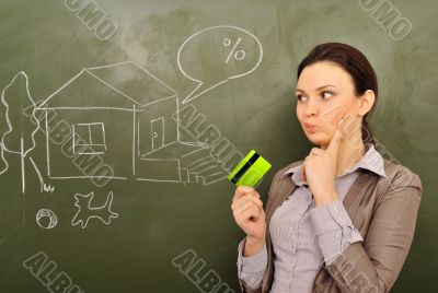 Closeup portrait of pretty young business woman against green bo