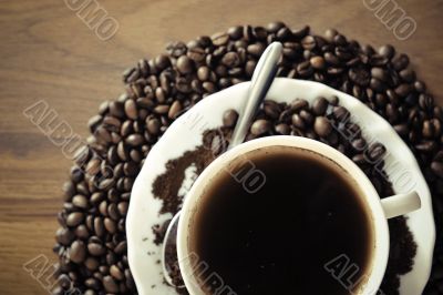 warm cup of coffee on brown background