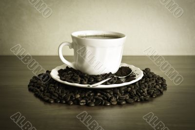 warm cup of coffee on brown background