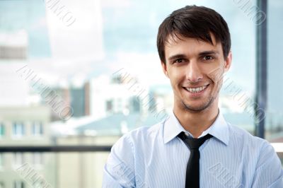 Portrait of young relaxed business man