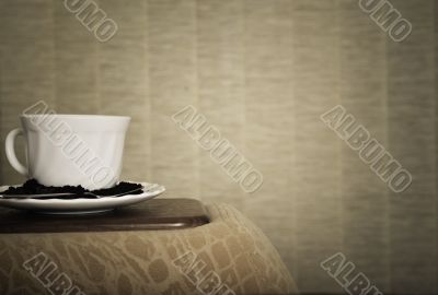 warm cup of coffee on brown background