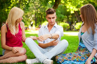 Portrait of three young teenagers laughing and having fun togeth