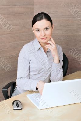 Portrait of a beautiful young businesswoman on the computer, lis