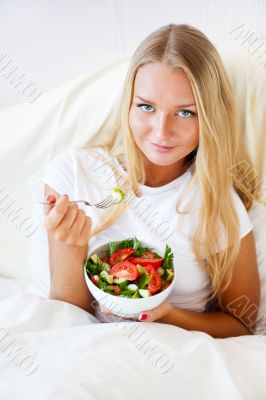 Closeup portrait of pretty caucasian woman having a healthy diet