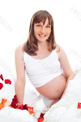 Image of pregnant woman touching her belly with hands