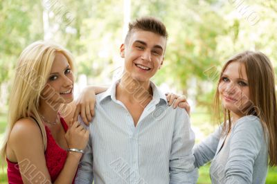 Portrait of three young teenagers laughing and having fun togeth