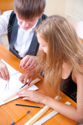 Portrait of college students working indoors looking happy