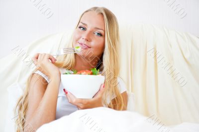 Closeup portrait of pretty caucasian woman having a healthy diet