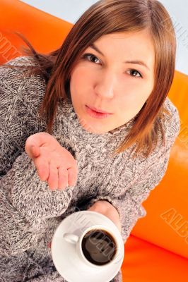 Beautiful woman holding cup of black coffee