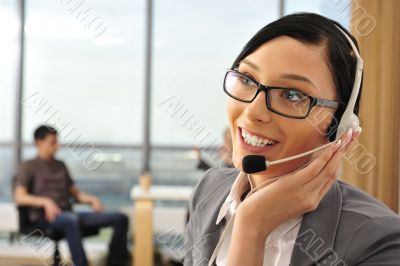 Portrait of a beautiful young businesswoman on the phone and hap
