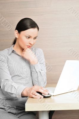 Portrait of a beautiful young businesswoman on the computer, thi