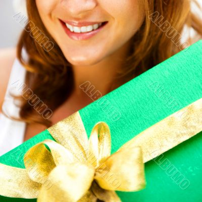 Portrait of young excited pretty woman standing inside shopping 