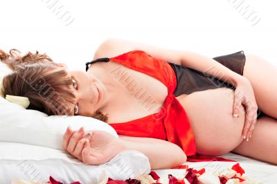 Image of pregnant woman touching her belly with hands