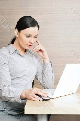 Portrait of a beautiful young businesswoman on the computer, tou