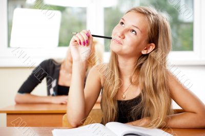 Portrait of a young group of students paying attention in class.