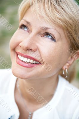 Portrait of a female smiling in a park