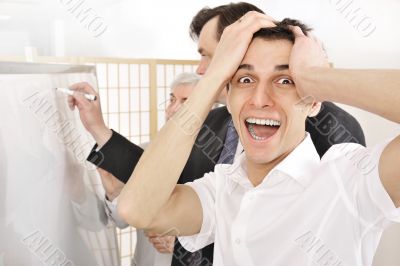 Portrait of a seminar and one man confused.