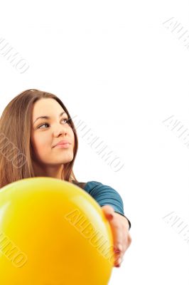 Young woman working out with a ball isolated on a white backgrou