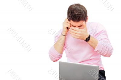 Closeup portrait of young man using laptop Closeup portrait of young man using laptop