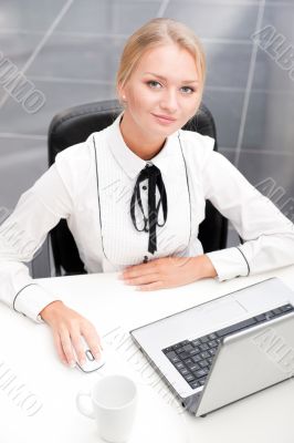 Beautiful business woman thinking about something while working 