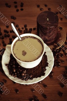 warm cup of coffee on brown background