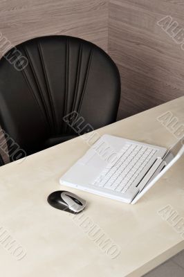 Portrait of an empty office desk.