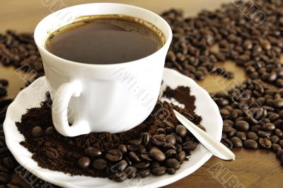 warm cup of coffee on brown background