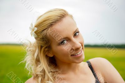 A portrait of a beautiful young Caucasian woman outdoor