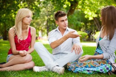 Portrait of three young teenagers laughing and having fun togeth